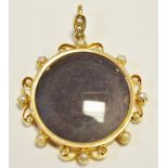A 15ct gold pearl set surround pendant