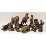 A collection of sculptures by Ken Norris including fox, squirrel, otter,