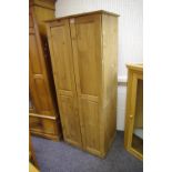 A modern pine two door wardrobe, 175cm high x 73.