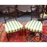 A pair of Victorian mahogany bedroom chairs, cresting top rail, pierced splat, stuffed overseat,