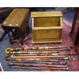 A mahogany box; an oak dropleaf side table; walking sticks;