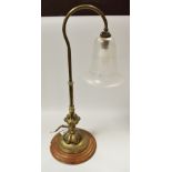 A brass and frosted glass desk lamp,