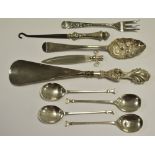 A George IV silver berry spoon; four silver teaspoons,