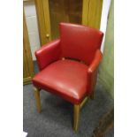 A retro red leatherette club chair.