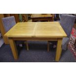 A modern oak extending dining table (2 leaves) with two fabric covered dining chairs (3)