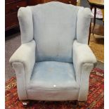 A late 19th/early 20th century scroll arm wingback reading chair,