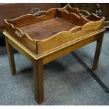 A mahogany tray top table