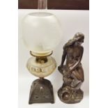 After John Dell, Miranda, a bronzed figure; a Victorian oil lamp, etched globe,