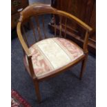 A Sheraton Revival bow backed tub chair, satinwood inlaid, tapering legs, c.