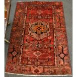 A hand woven Hamadan carpet, geometric designs in tones of burgundy ,