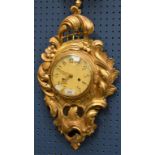 A contemporary giltwood cartel type wall clock