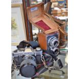 Photographic Equipment - a Halina Reflex box style camera, leather case; an Olympus CM20 camera,