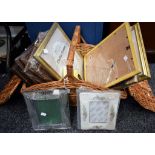 A large wicker picnic basket, containing a quantity of photograph frames, various,