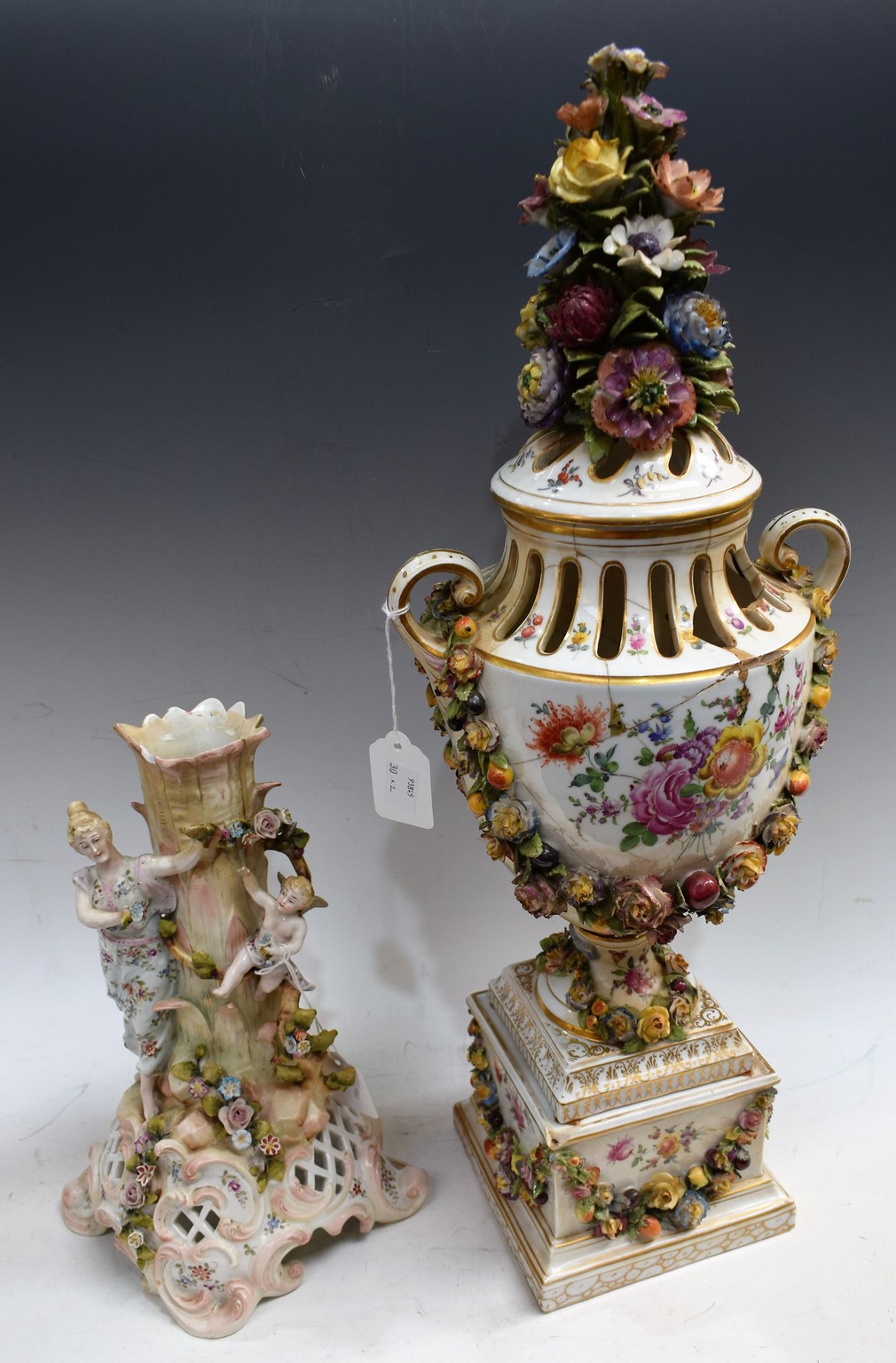 A large 19th century vase and cover on a pedestal;