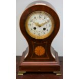 An Edwardian mahogany balloon shaped mantel clock, 30.