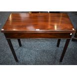 A George III style mahogany tea table, folding rectangular top above a deep frieze,