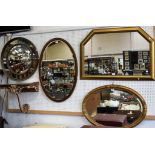 A large oval early 20th century wall mirror;