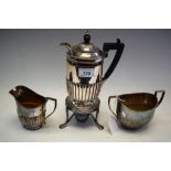 Silverplate - a chocolate warming jug and burner;