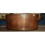 A Victorian oval copper cooking vessel, each handle stamped '19',