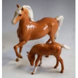 A Beswick Palamino, approx 17cm in height; a Beswick palamino foal,