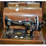 A late 19th/early 20th century Singer hand cranked sewing machine, serial no Y172415,