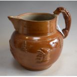 A 19th century salt glazed stoneware Brampton hunting jug, applied decoration, handle as a hound, c.