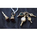 A collection of five 19th century stone set fob watch keys;