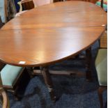 An Old Charm oak gateleg table, opening to 152.