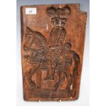 A biscuit mould, depicting a man on horseback,