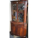 A George III style floor standing corner display cabinet, 179.