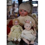 Dolls - a Johann Walther & Sohn porcelain socket head doll, fixed eyes, open mouth with teeth,