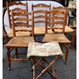 A harlequin set of five Lancashire ladderback rush seated side chairs;