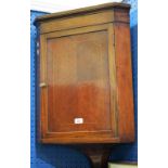 A George III style corner cupboard