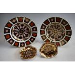 A pair of Royal Crown Derby 1128 pattern soup dishes; a pair of 1128 pattern five petal trays,