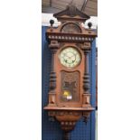 A 19th century Vienna wall clock, cream dial, architectural case, Arabic numerals,