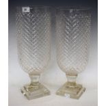 A pair of 'diamond cut' pedestal vases,