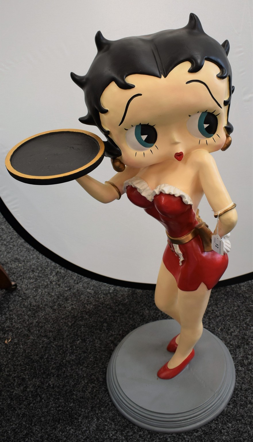 A floor standing figure, Betty Boop, arm outstretched holding a plateau,