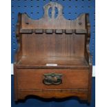 An Arts and Crafts oak smoking room cabinet,