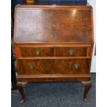 A Queen Anne style walnut bureau, locked fall front above two short and one long drawer,