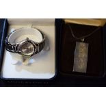 A silver ingot pendant, oversize hallmarks; an Anne Klein lady's wristwatch,