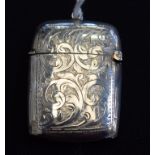 A silver vesta case, engraved scrolling foliate decoration, vacant cartouche,
