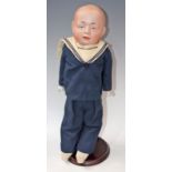 A Gebruder Knoch sailor boy shoulder doll, moulded bisque head, painted blue eyes, smirking mouth,