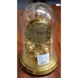 A Hermle brass anniversary clock, of small proportions,