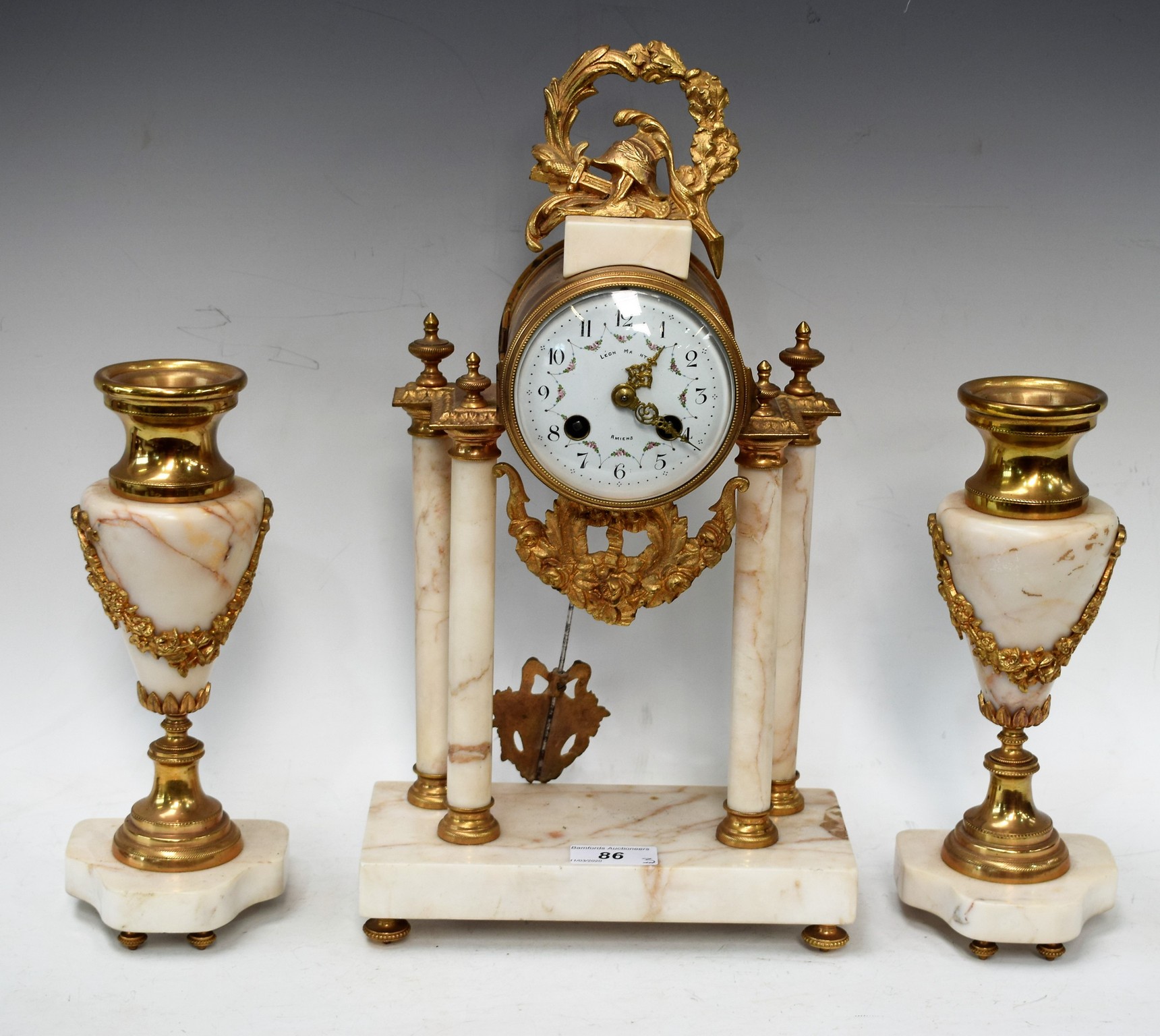 A French portico clock garniture, gilt brass mounted,