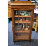 An oak leaded glazed bookcase, c.