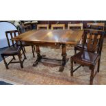 A mid-20th century oak drawleaf dining table;