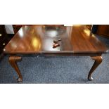 A Queen Anne style extending dining table, moulded rounded rectangular top, cabriole legs, pad feet,