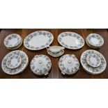 Ceramics - a Wedgwood Ashford pattern dinner service including plates, bowls, oval meat platters,
