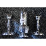 A pair of silver boudoir candlesticks, weighted, Birmingham 1962,