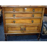 An early-mid 20th century oak two piece bedroom suite comprising dressing chest and chest (2)
